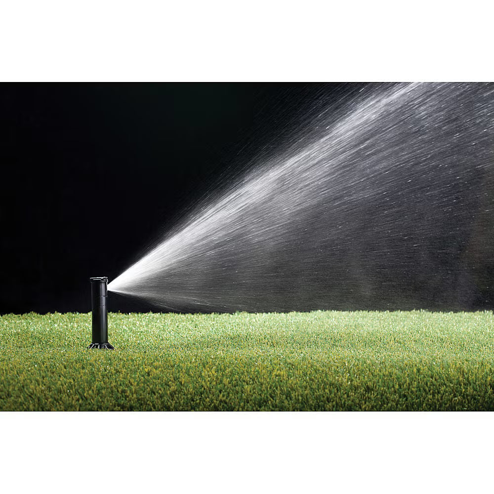 Rain Bird 3500 Sprinkler spraying water onto grass with a black background