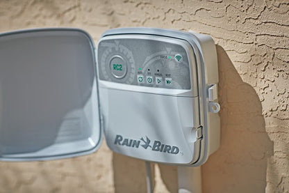 Rain Bird RC2 irrigation controller mounted on a wall